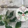 Hand Painted Flat Christmas Bauble With Holly And Berries Design