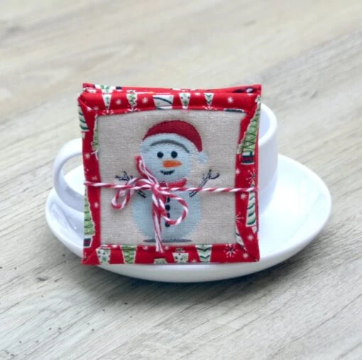 Set Of Four Quilted Christmas Coasters With Santa, Snowmen, Trees And Snowflakes