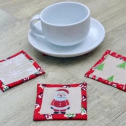 Set Of Four Quilted Christmas Coasters With Santa, Snowmen, Trees And Snowflakes -Christmas Homeware & Accessories Shop featureditemlargei 659
