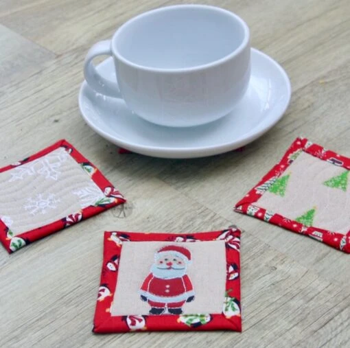Set Of Four Quilted Christmas Coasters With Santa, Snowmen, Trees And Snowflakes -Christmas Homeware & Accessories Shop featureditemlargei 659