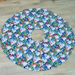 Christmas Tree Skirt With Snowman Patterned Fabric And Ribbon Ties.